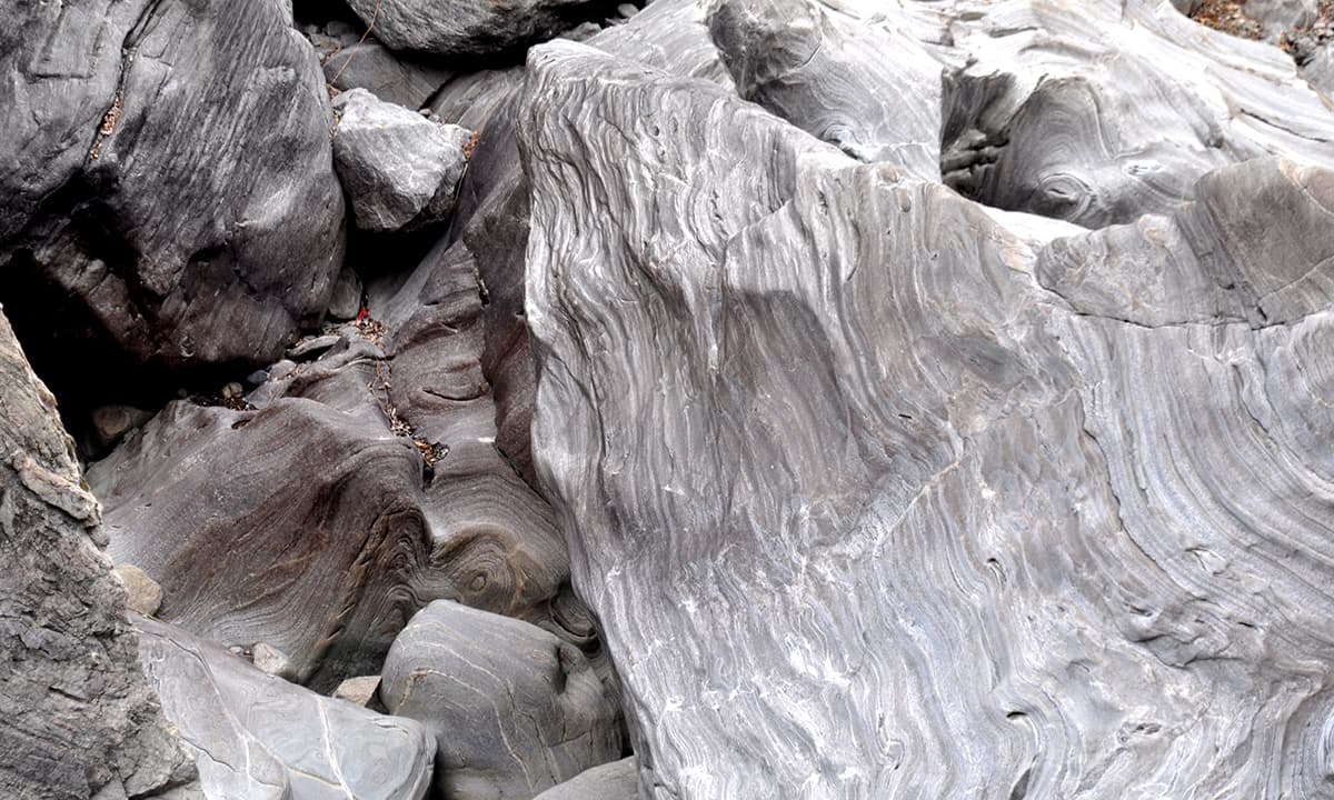 Granite rocks shimmer in a mountain stream