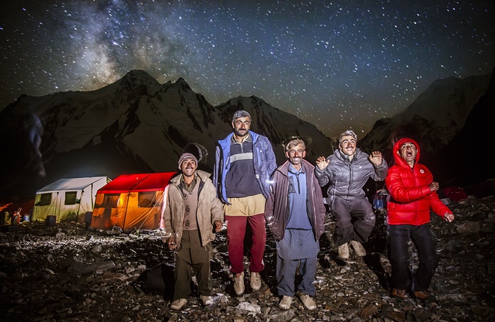 10. The porters photographed outside at base camp. They sometimes light fires using rubbish from the expeditions